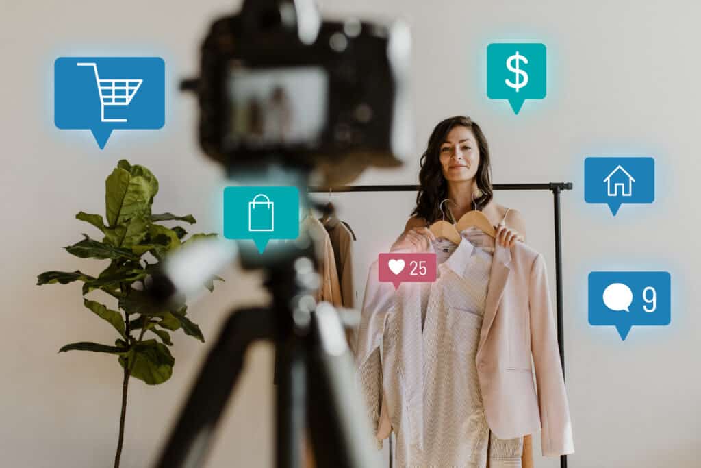 Woman presenting clothing on camera with social media and shopping icons floating around her in a modern room. | Tsunami Reach