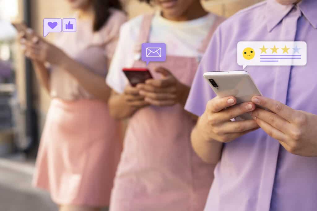 Three young women using smartphones, with social media icons and notifications floating beside their devices. | Tsunami Reach