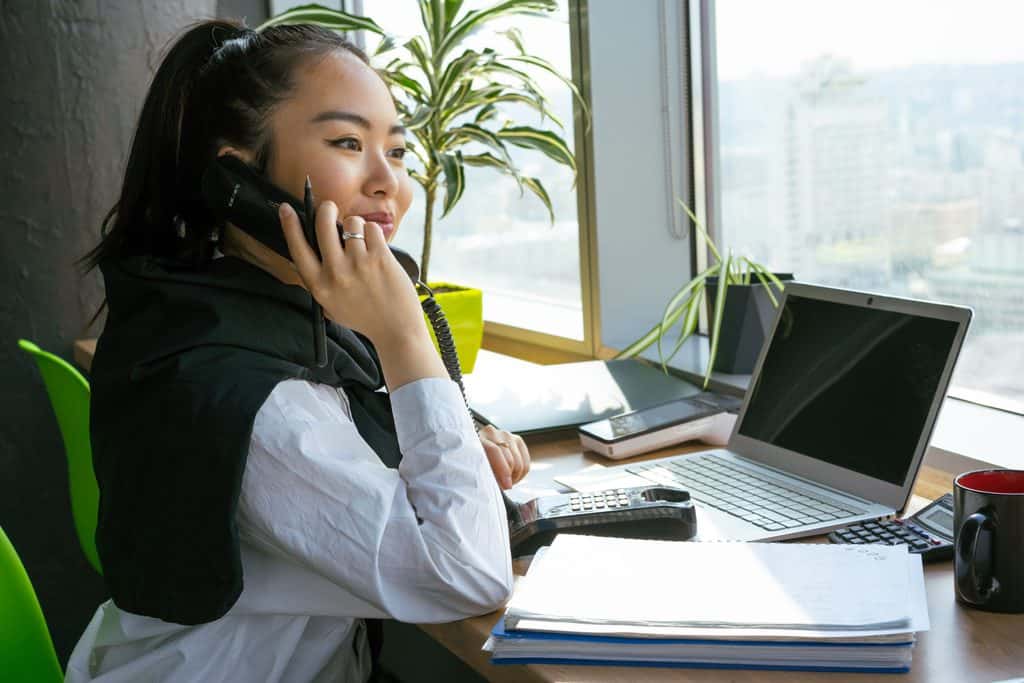An account manager have a conversation with the client. | Tsunami Reach